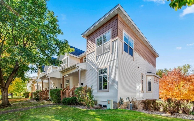 1229 Clarence St, Saint Paul, MN 55106 - view of side of property with a lawn