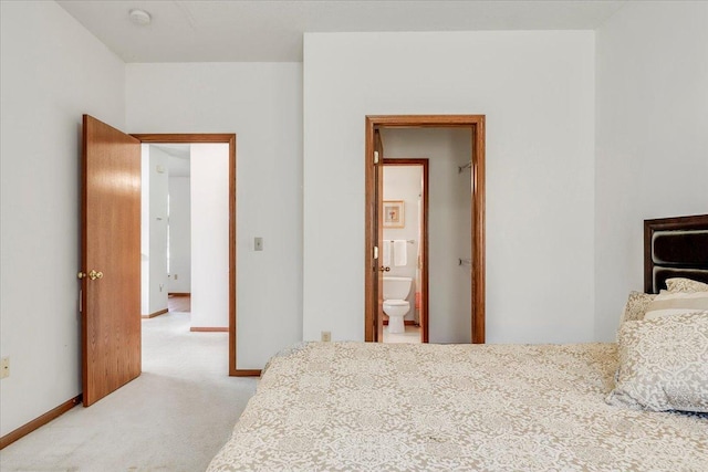 1229 Clarence St, Saint Paul, MN 55106 - bedroom with light carpet, baseboards, and connected bathroom