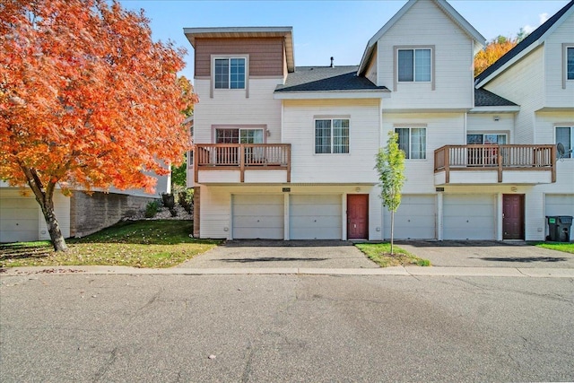 1229 Clarence St, Saint Paul, MN 55106 - multi unit property with a balcony, driveway, and an attached garage