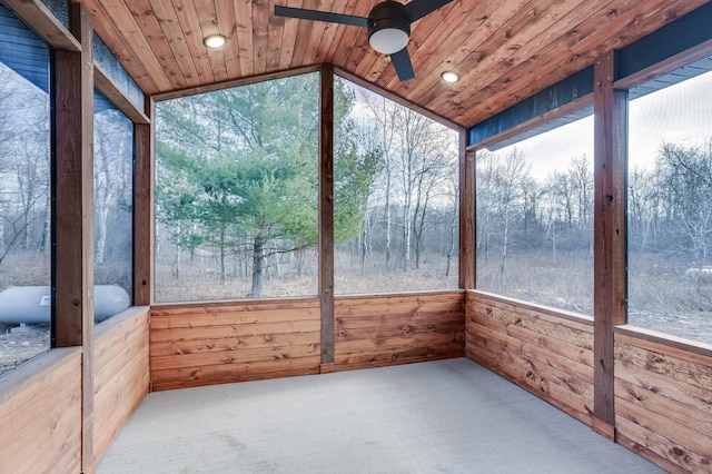 unfurnished sunroom featuring wooden ceiling, lofted ceiling, and ceiling fan