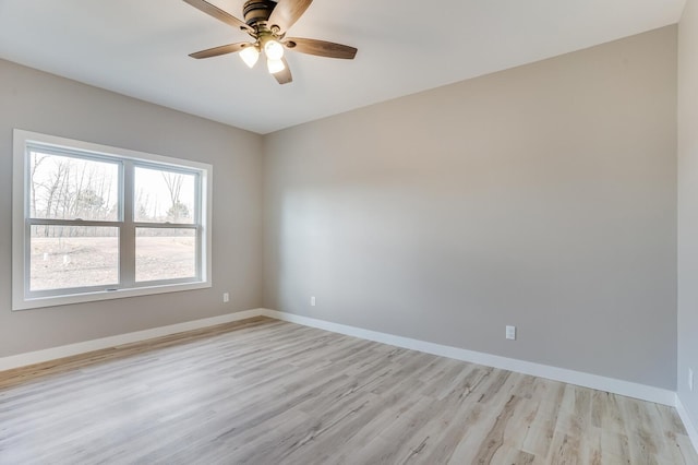 unfurnished room featuring light wood-type flooring and ceiling fan