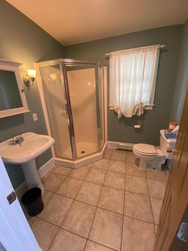 bathroom with toilet, walk in shower, and tile patterned floors