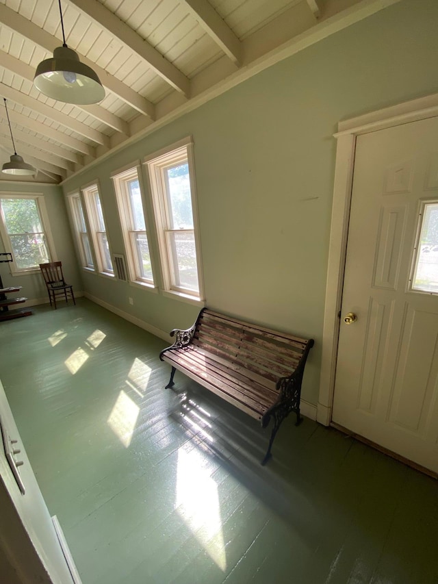 foyer entrance with a wealth of natural light, vaulted ceiling with beams, and wooden ceiling