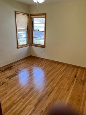 empty room featuring light hardwood / wood-style flooring and ceiling fan