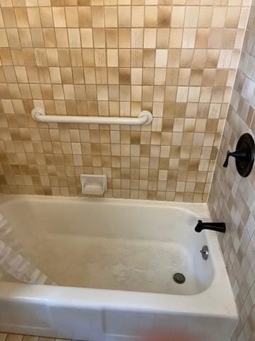 bathroom featuring a tub to relax in