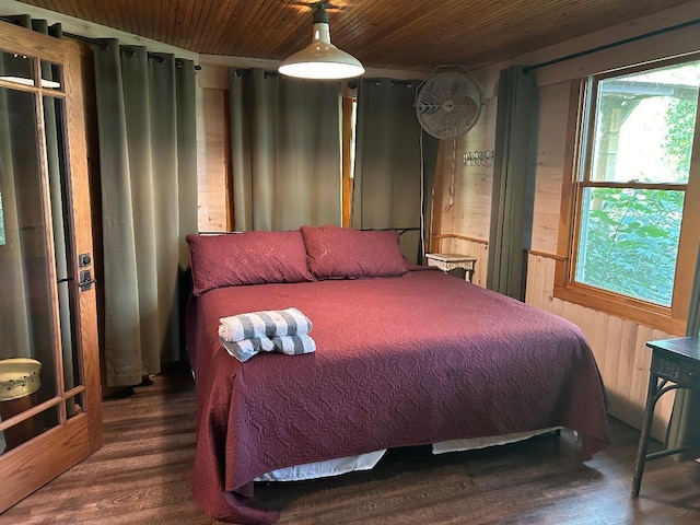 7155 Oak Narrows Rd, Greenwood Twp, MN 55723 - bedroom with wood ceiling, wood finished floors, and wooden walls