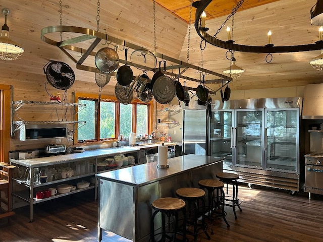 7155 Oak Narrows Rd, Greenwood Twp, MN 55723 - kitchen featuring wood ceiling, high vaulted ceiling, stainless steel refrigerator, dark wood-type flooring, and a kitchen island