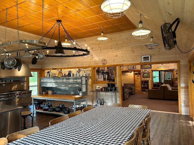 7155 Oak Narrows Rd, Greenwood Twp, MN 55723 - dining room with wood walls, wood finished floors, wood ceiling, and a chandelier
