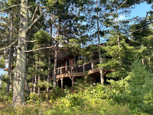 7155 Oak Narrows Rd, Greenwood Twp, MN 55723 - rear view of property with a wooden deck and a wooded view