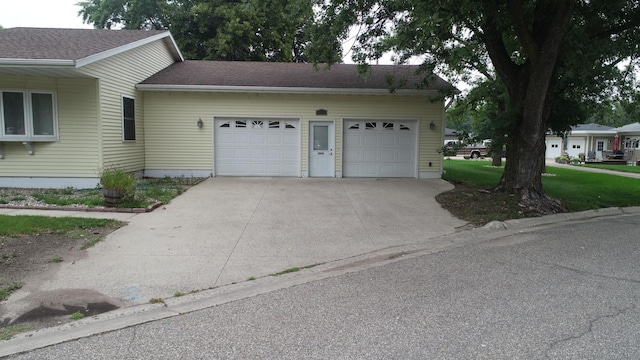 view of side of home featuring a garage