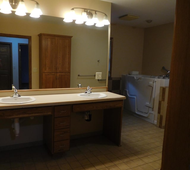 bathroom with tile patterned flooring and vanity