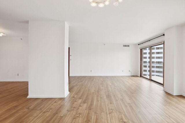 empty room featuring light hardwood / wood-style floors