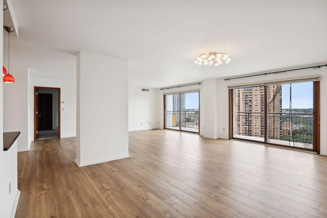 spare room with light hardwood / wood-style floors