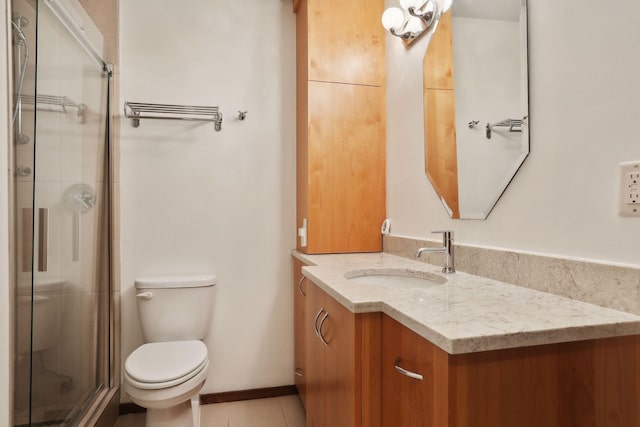 bathroom featuring an enclosed shower, tile patterned flooring, toilet, and vanity