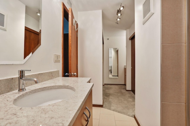 bathroom with vanity and tile patterned floors