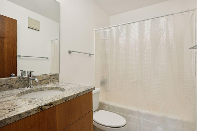 full bathroom with vanity, toilet, and shower / bath combination with curtain