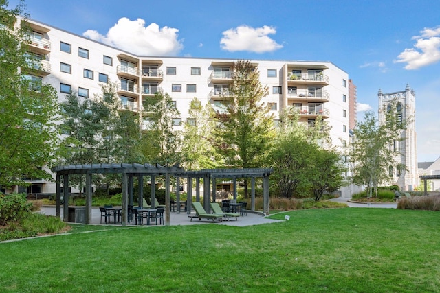 surrounding community featuring a pergola, a yard, and a patio