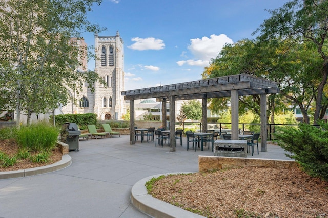 view of home's community featuring a pergola and a patio