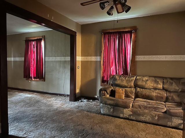 carpeted living room featuring ceiling fan