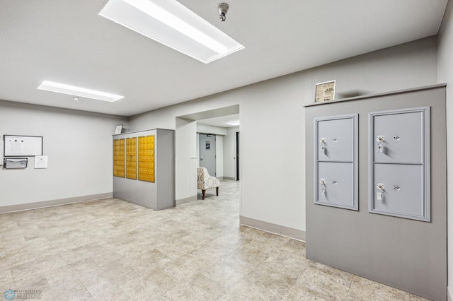 empty room featuring tile patterned floors and baseboards