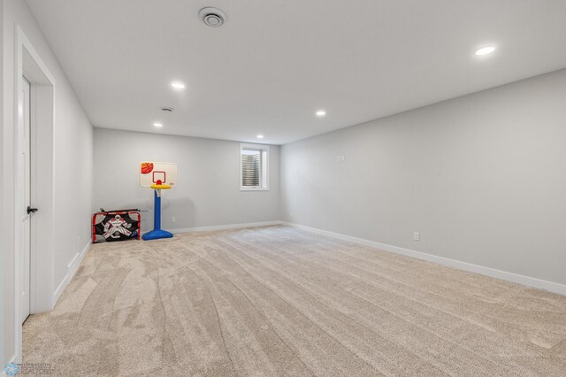 basement with light colored carpet