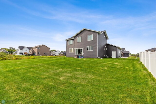 back of house with a yard