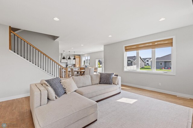 living room with light hardwood / wood-style flooring