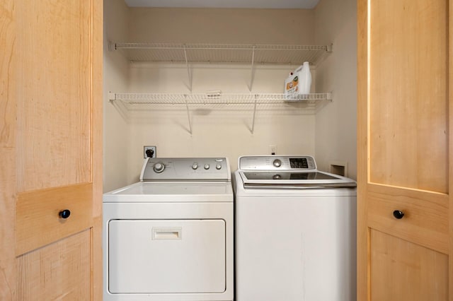 laundry area featuring separate washer and dryer