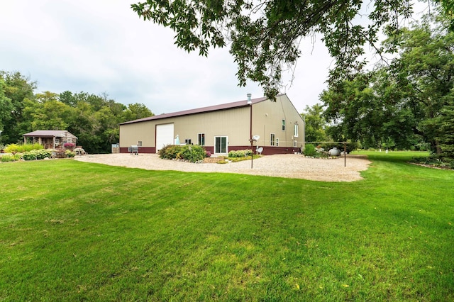 back of property with volleyball court and a lawn