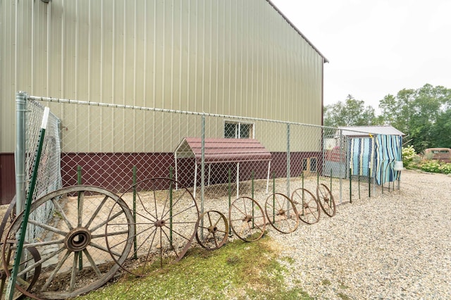 view of home's exterior with an outdoor structure