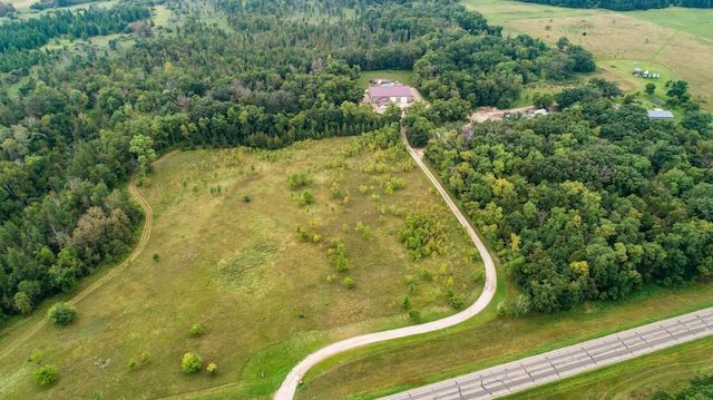 birds eye view of property with a wooded view