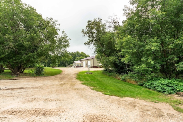 exterior space featuring dirt driveway