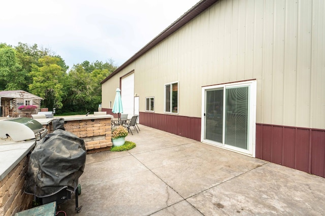 view of patio featuring outdoor dining area