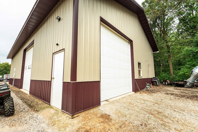 view of property exterior with an outbuilding