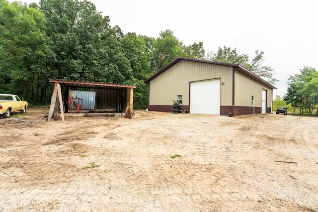 view of outdoor structure with a carport and an outdoor structure