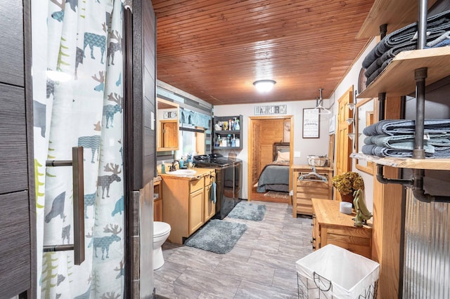 kitchen with a sink, wood ceiling, and light countertops