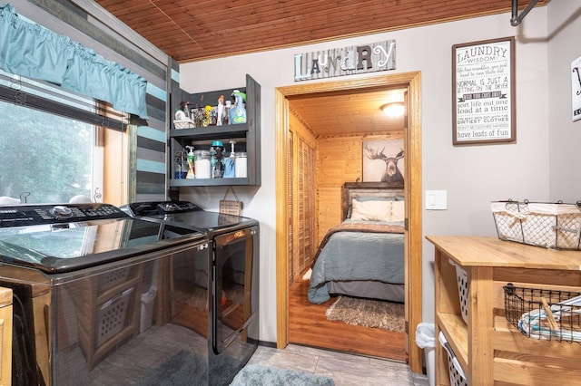 bedroom with washing machine and clothes dryer and wooden ceiling