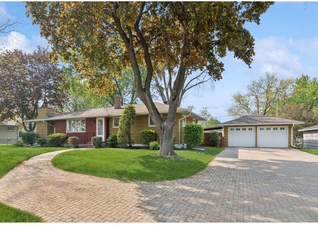 single story home with a garage, an outdoor structure, and a front lawn