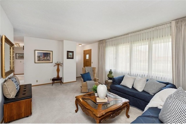 carpeted living room with a textured ceiling