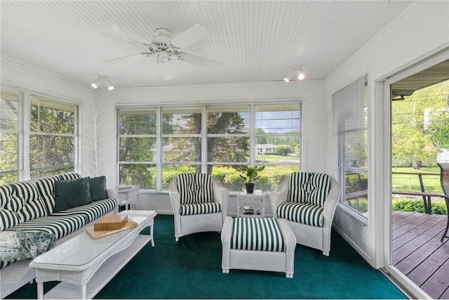 sunroom / solarium with ceiling fan