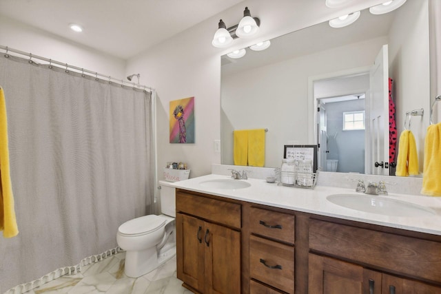 bathroom featuring toilet, a shower with curtain, and vanity