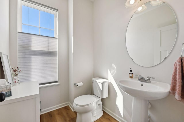 bathroom featuring toilet and hardwood / wood-style flooring