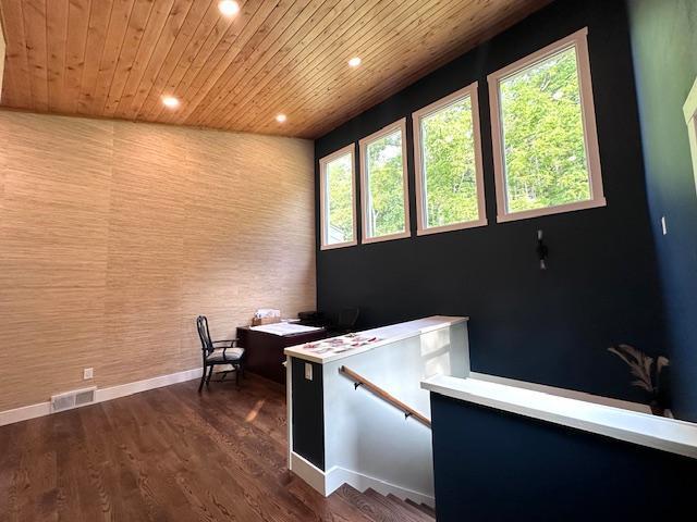 office featuring dark wood-type flooring, recessed lighting, wood ceiling, and baseboards