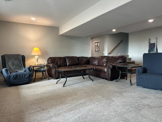 carpeted living area featuring recessed lighting