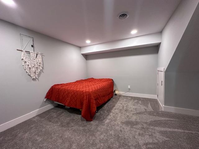 bedroom featuring recessed lighting, dark carpet, visible vents, and baseboards