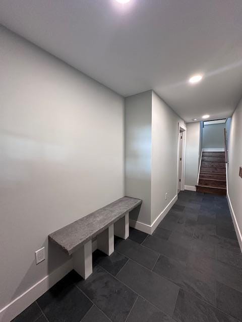 hall with stairway and baseboards