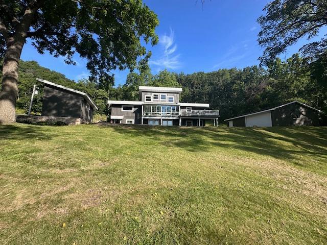 exterior space featuring a deck and a front yard