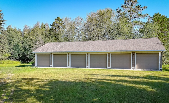 garage with a lawn