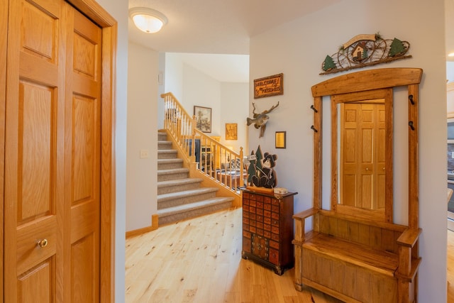 foyer entrance with light hardwood / wood-style flooring