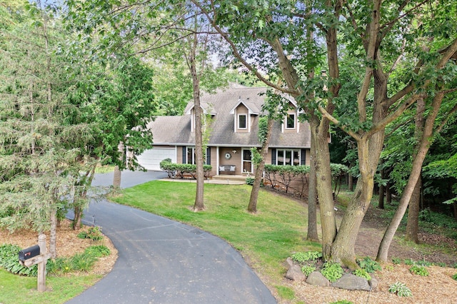 view of front of home with a garage and a front yard